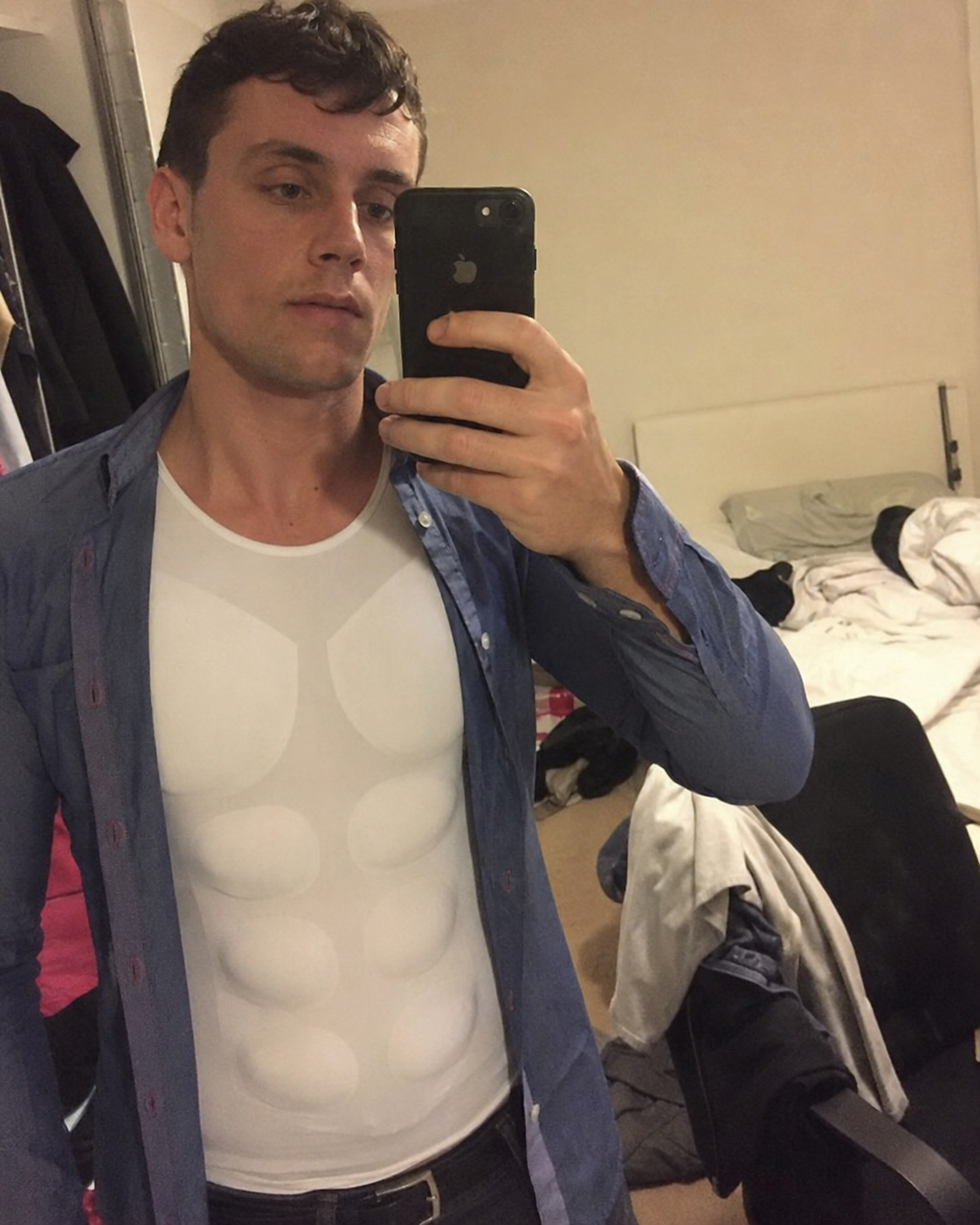 Customer bedroom selfie showing the padded muscle shirt