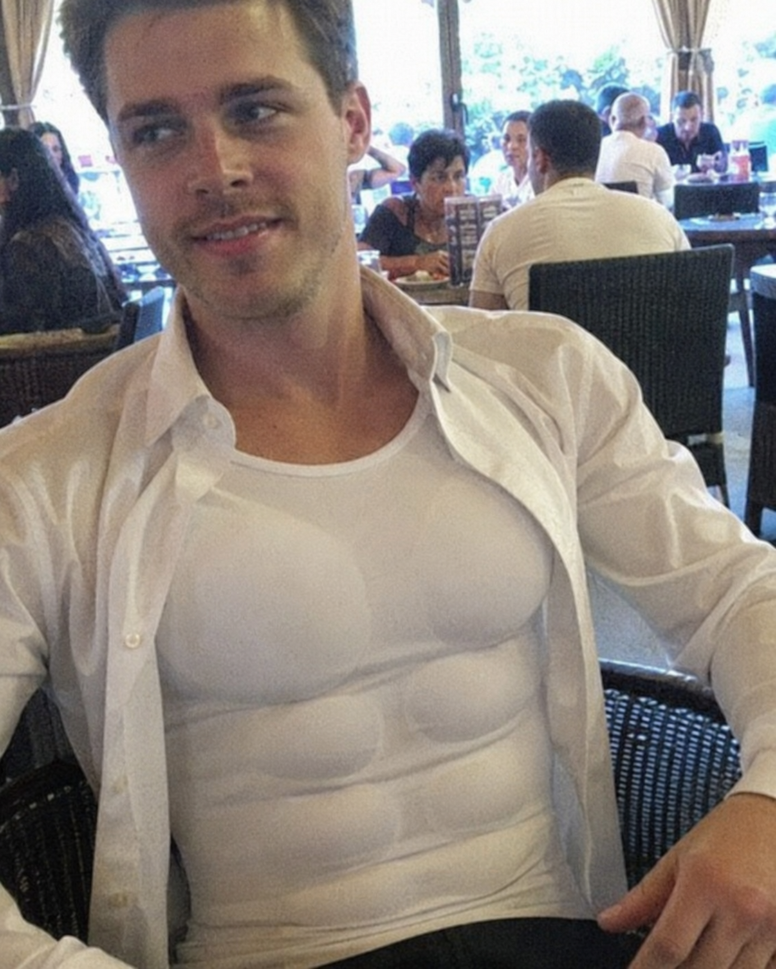 Customer restaurant photo wearing the muscle shaper under a shirt