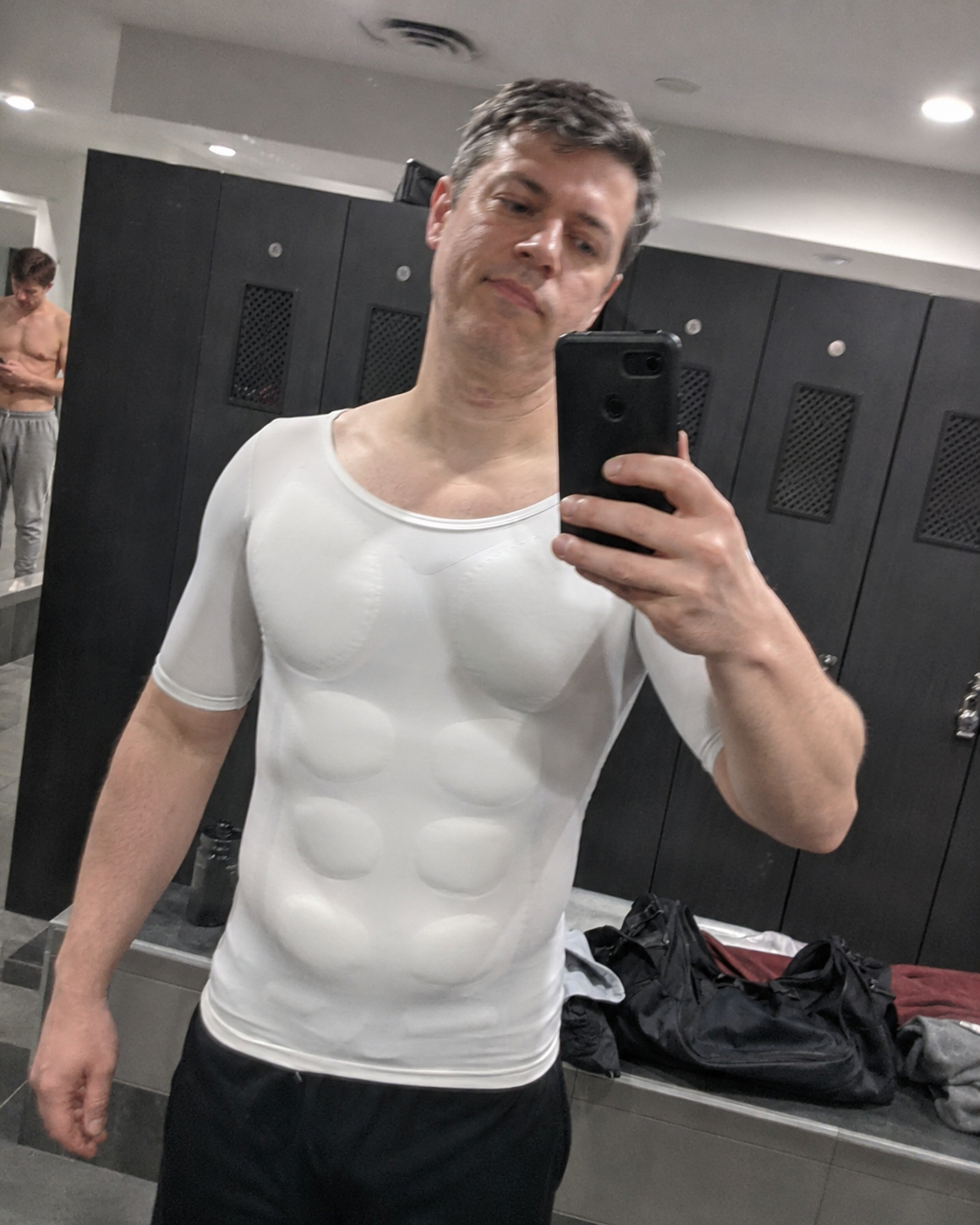 Customer casual mirror selfie showing the padded undershirt