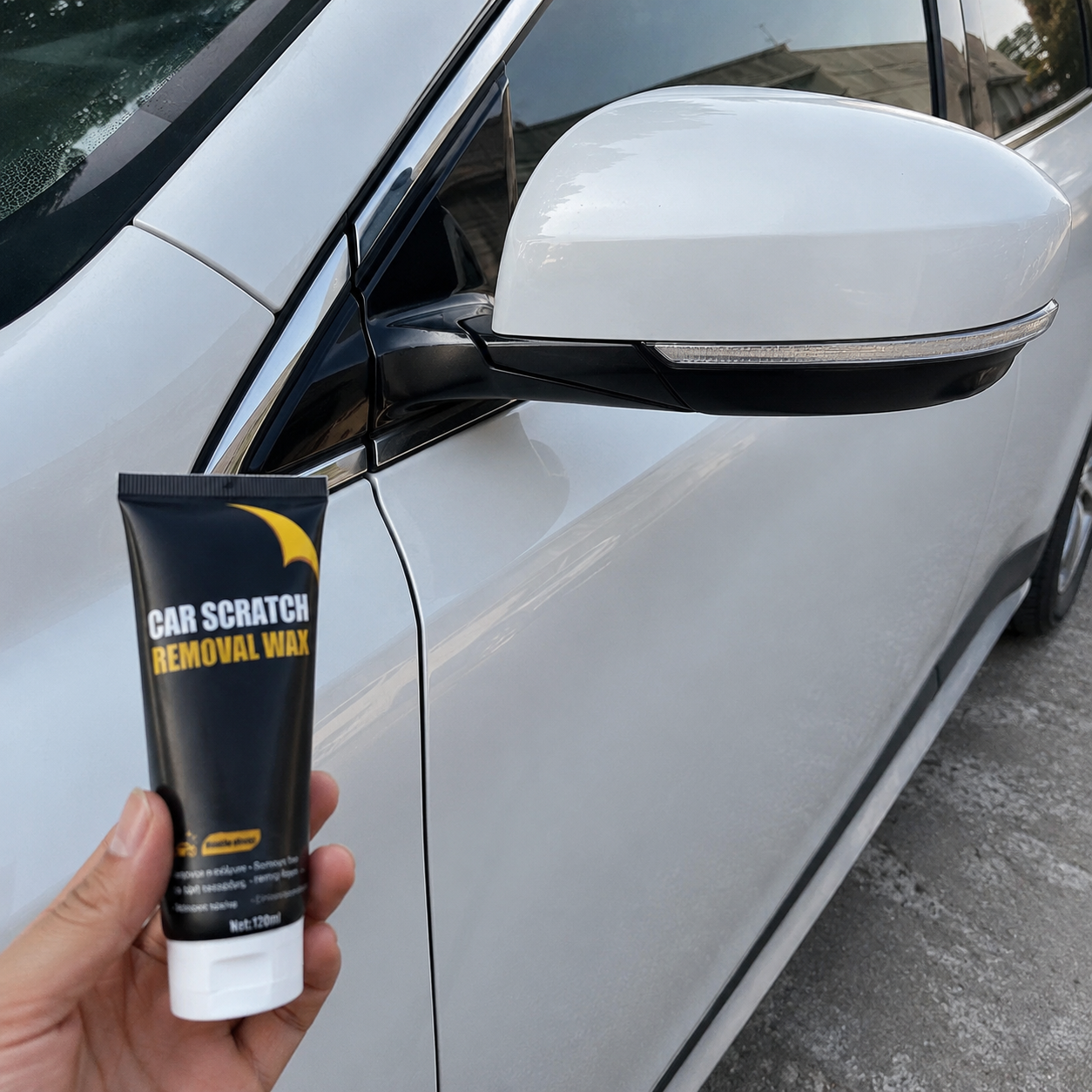 Car scratch repair paste used on a light-colored door panel