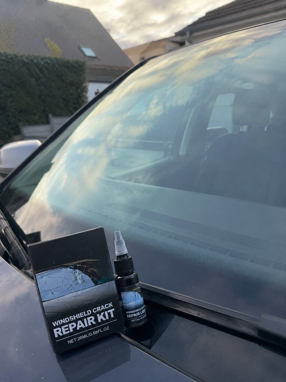 Windshield repair resin curing on the glass