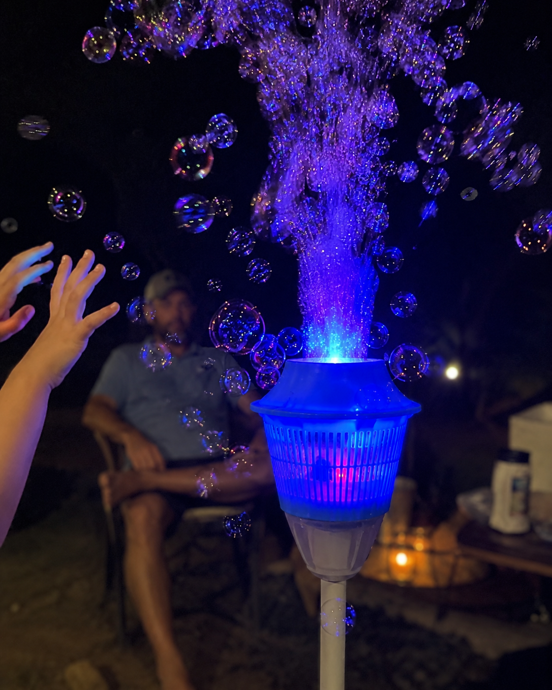 Glowing bubble fountain tower running at night
