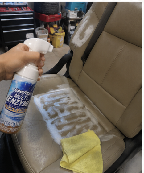 Customer cleaning a stained car seat